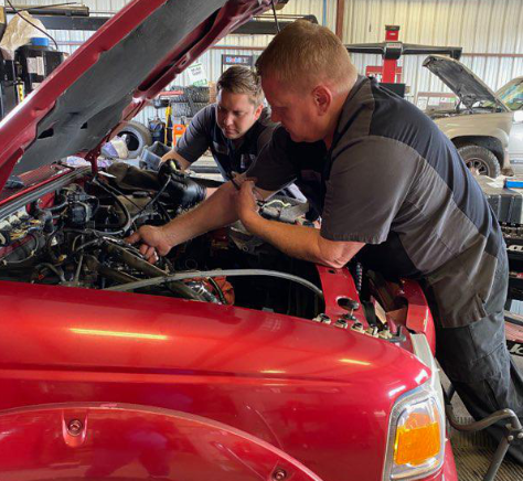 Mechanic from CH Auto Repair looking at car
